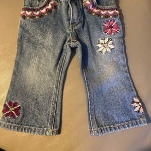 Levi’s  I adorable flower blue jeans. 12 months
